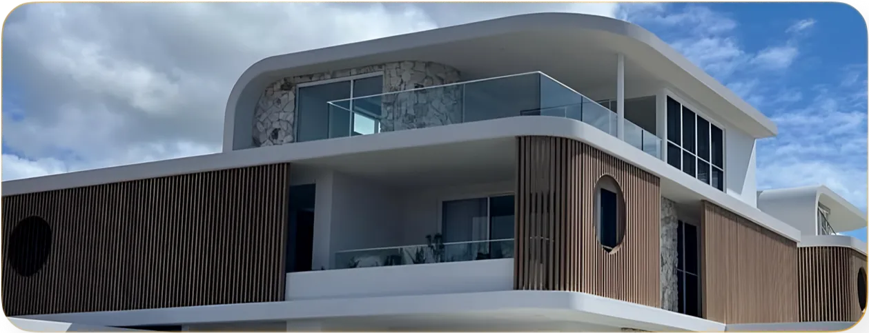 Multi-storey building with curved white balcony edges and dark woodgrain aluminium battens