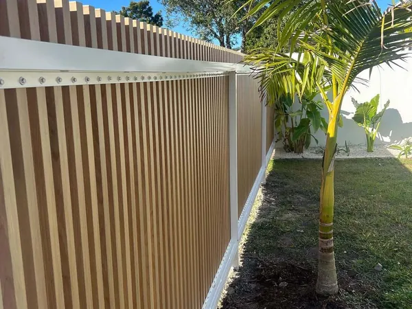 Woodgrain aluminium cladding panels with a vertical shadowline joint