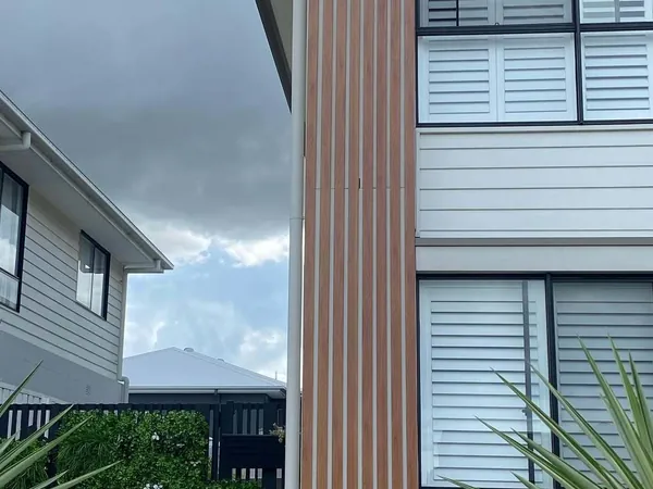 Woodgrain aluminium cladding running across a residential facade